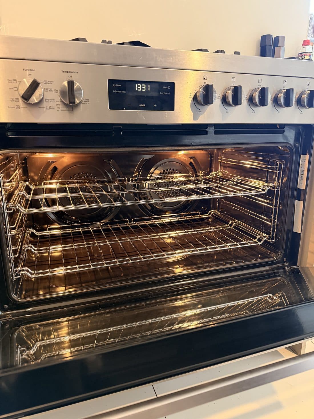 Interior of a premium European multi-function oven after an Oven Valets clean, with sparkling racks, cavity and door glass
